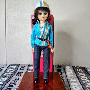 Vintage Doll with Blue Outfit and Helmet